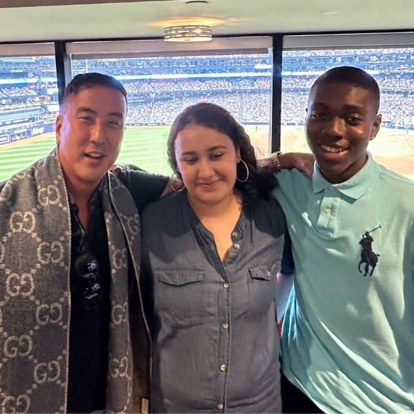 Dr. Robert Yanagawa and two Next Surgeon participants attending a Toronto Blue Jays game.